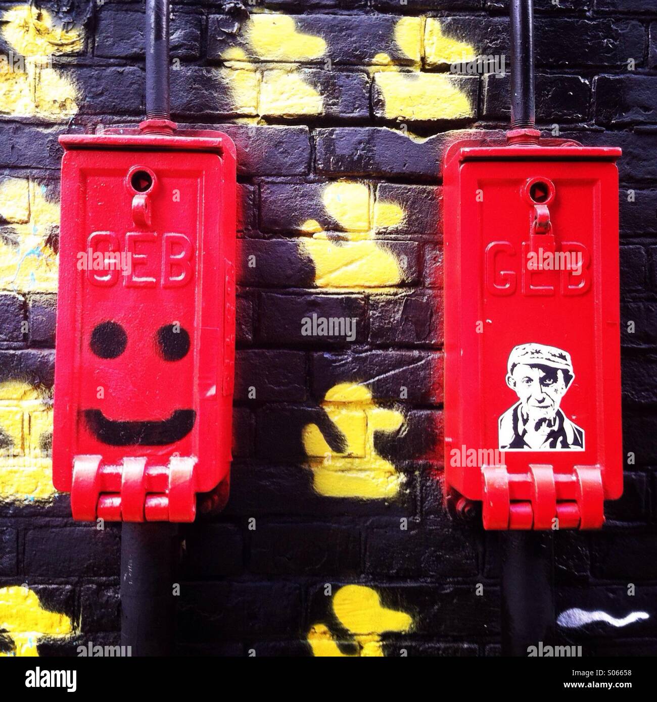 Red Electrical boxes with graffiti on them. Amsterdam, the Netherlands. Europe. Stock Photo