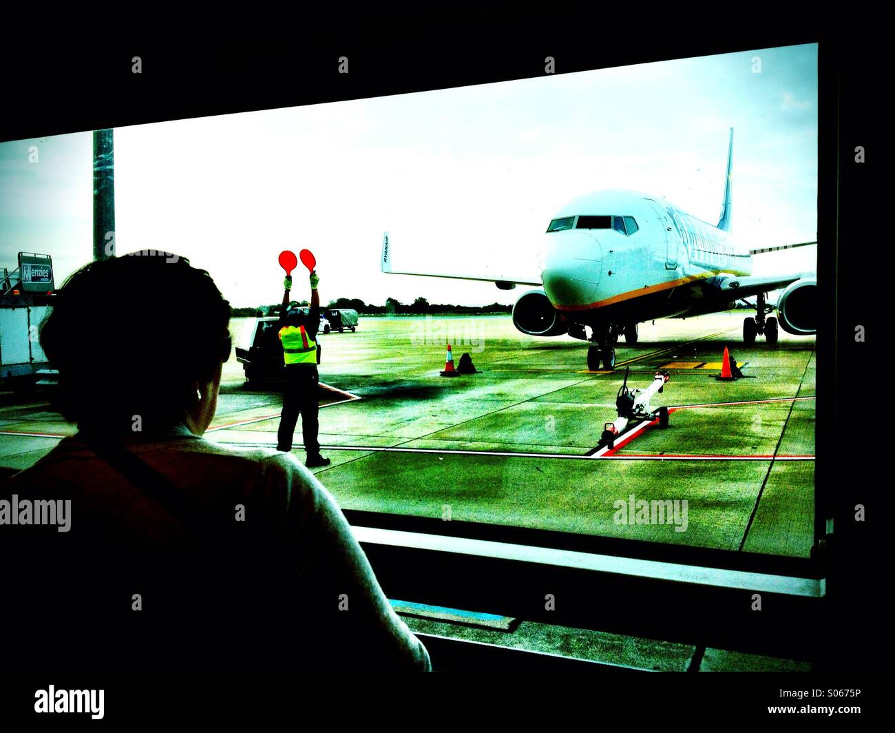Watching the Flight Arrive - Smartphone Captured Stock Image