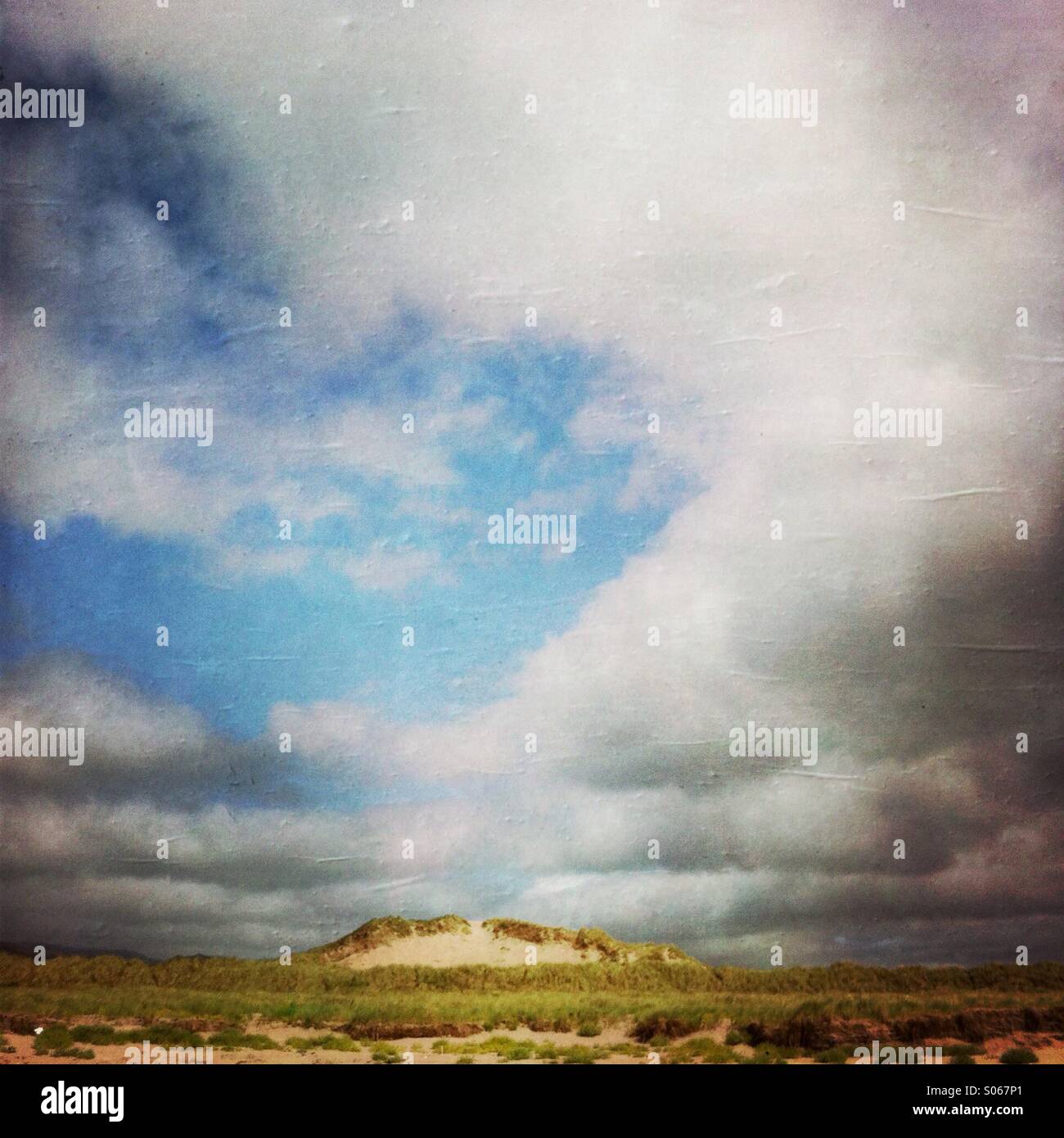 A sand dune and clouds at Inch beach, dingle peninsula, county Kerry Ireland Europe. - Smartphone Captured Stock Image