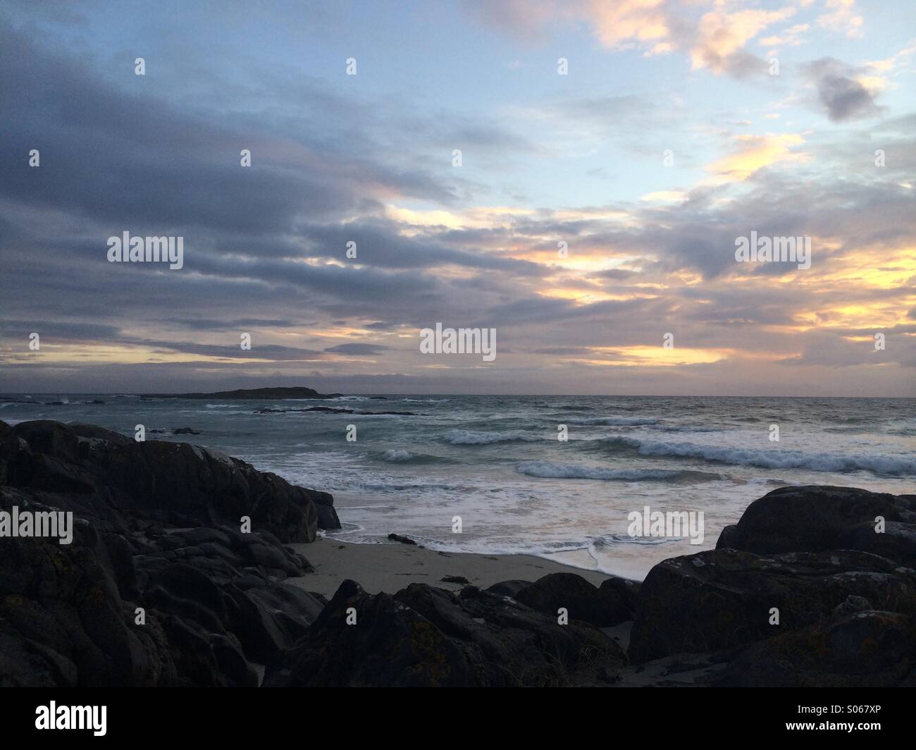 Sunset over stormy sea Stock Photo