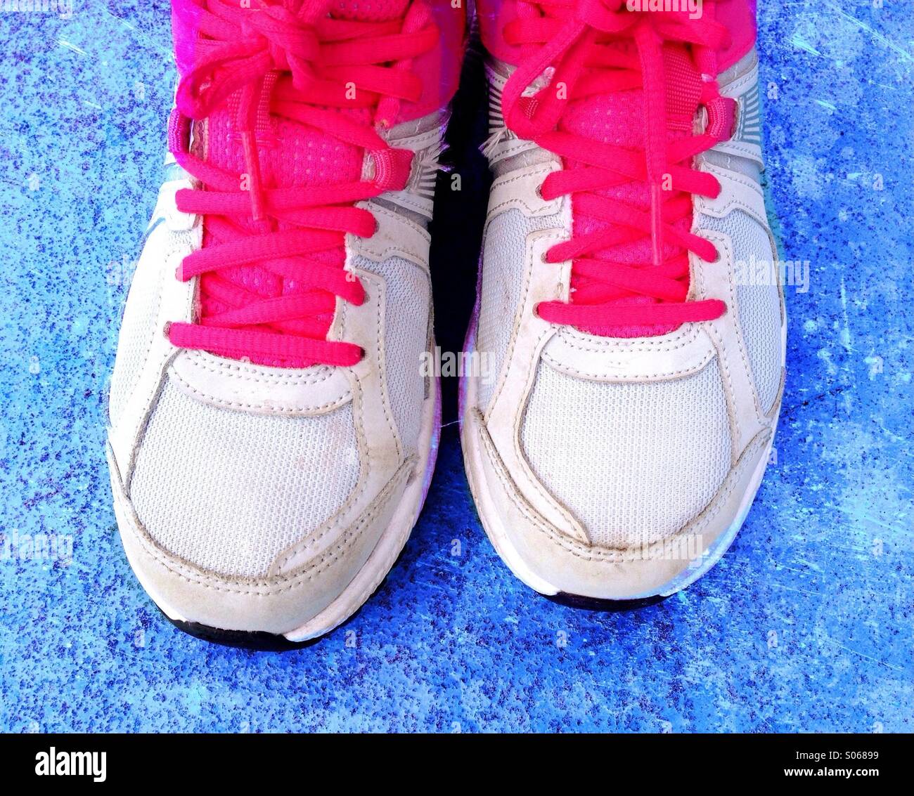 Pink trainer laces against blue background - Smartphone Captured Stock Image