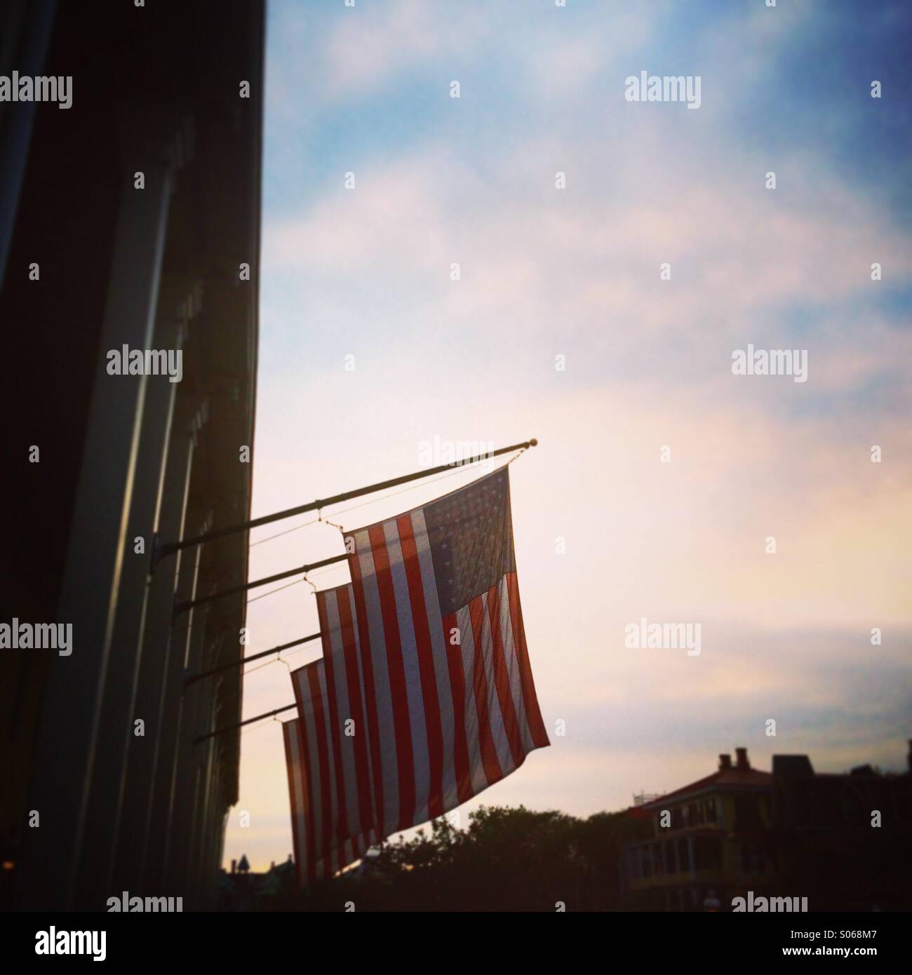 American flags hanging outside Congress Hall in Cape May, New Jersey, at sunset. Stock Photo