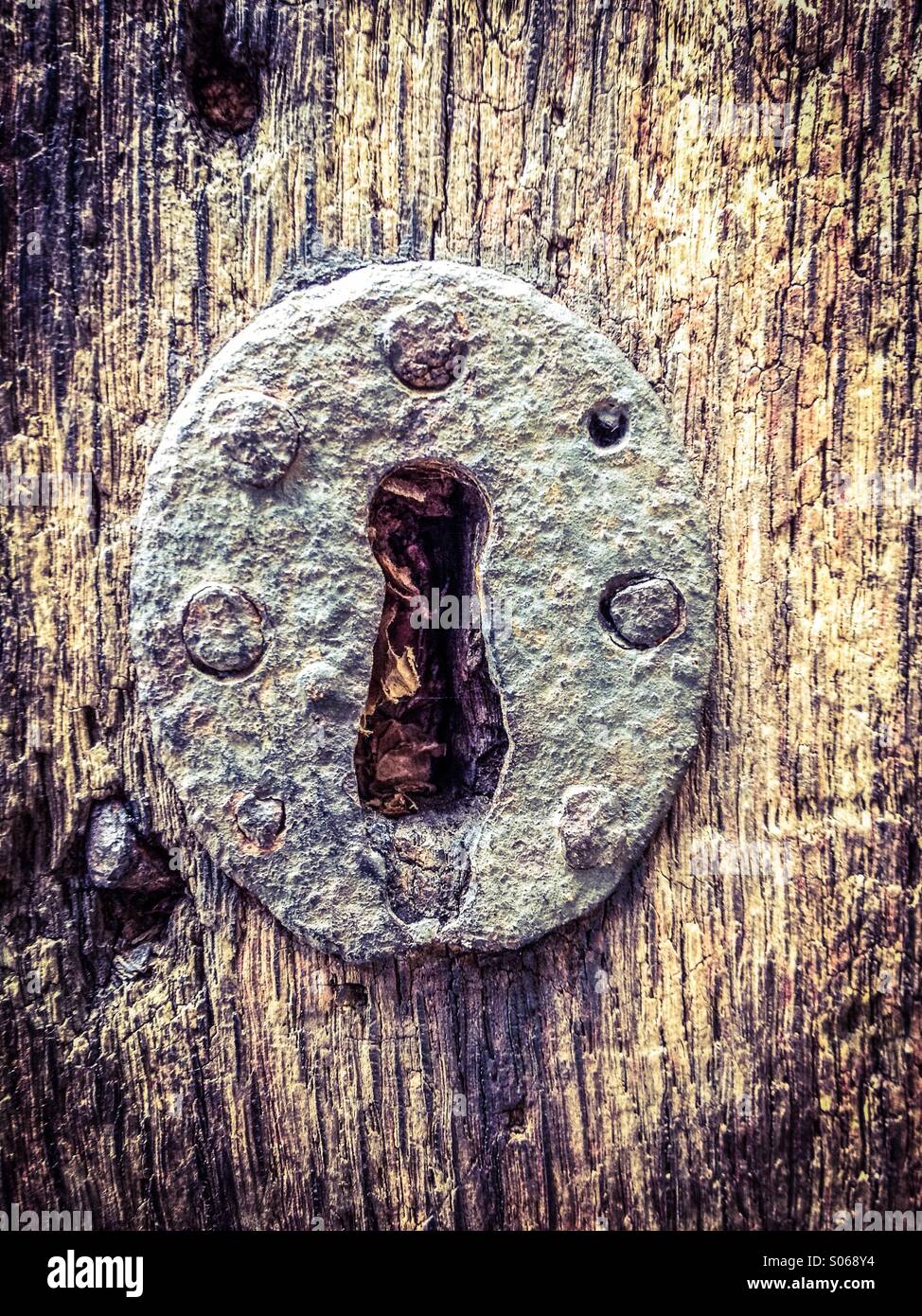 Keyhole in old wooden door - Smartphone Captured Stock Image