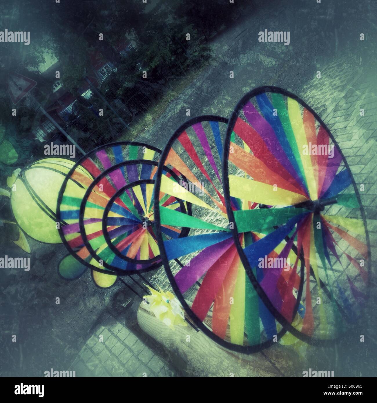 Wind wheels in different colours for children. Retro styled postprocessing. - Smartphone Captured Stock Image