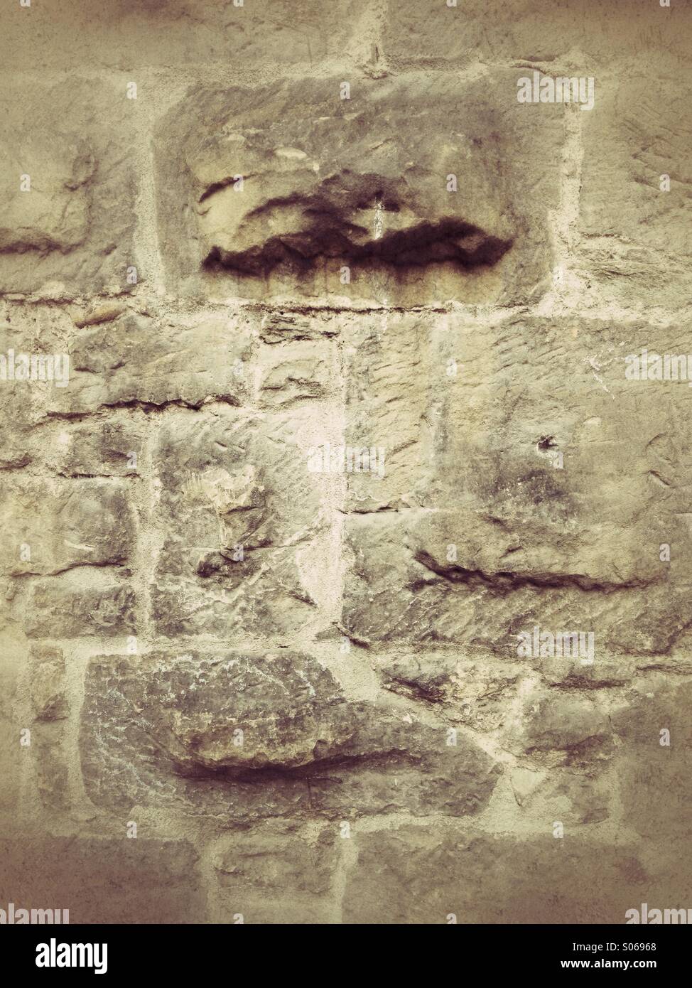 Ancient medieval stone wall background. Retro styled postprocessing. - Smartphone Captured Stock Image