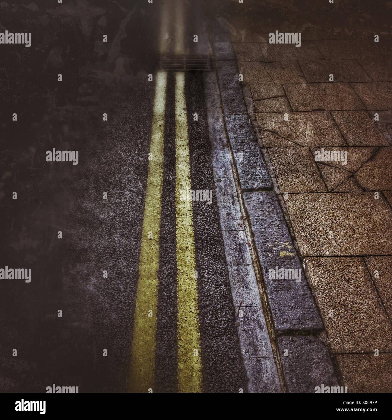 Double yellow lines painted on a road Stock Photo Alamy