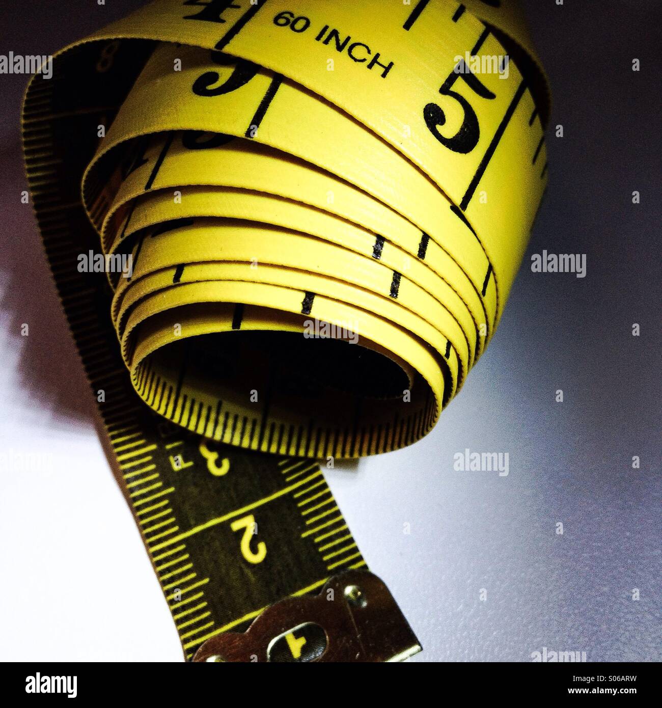 A measuring tape used to determine measurements. - Smartphone Captured Stock Image