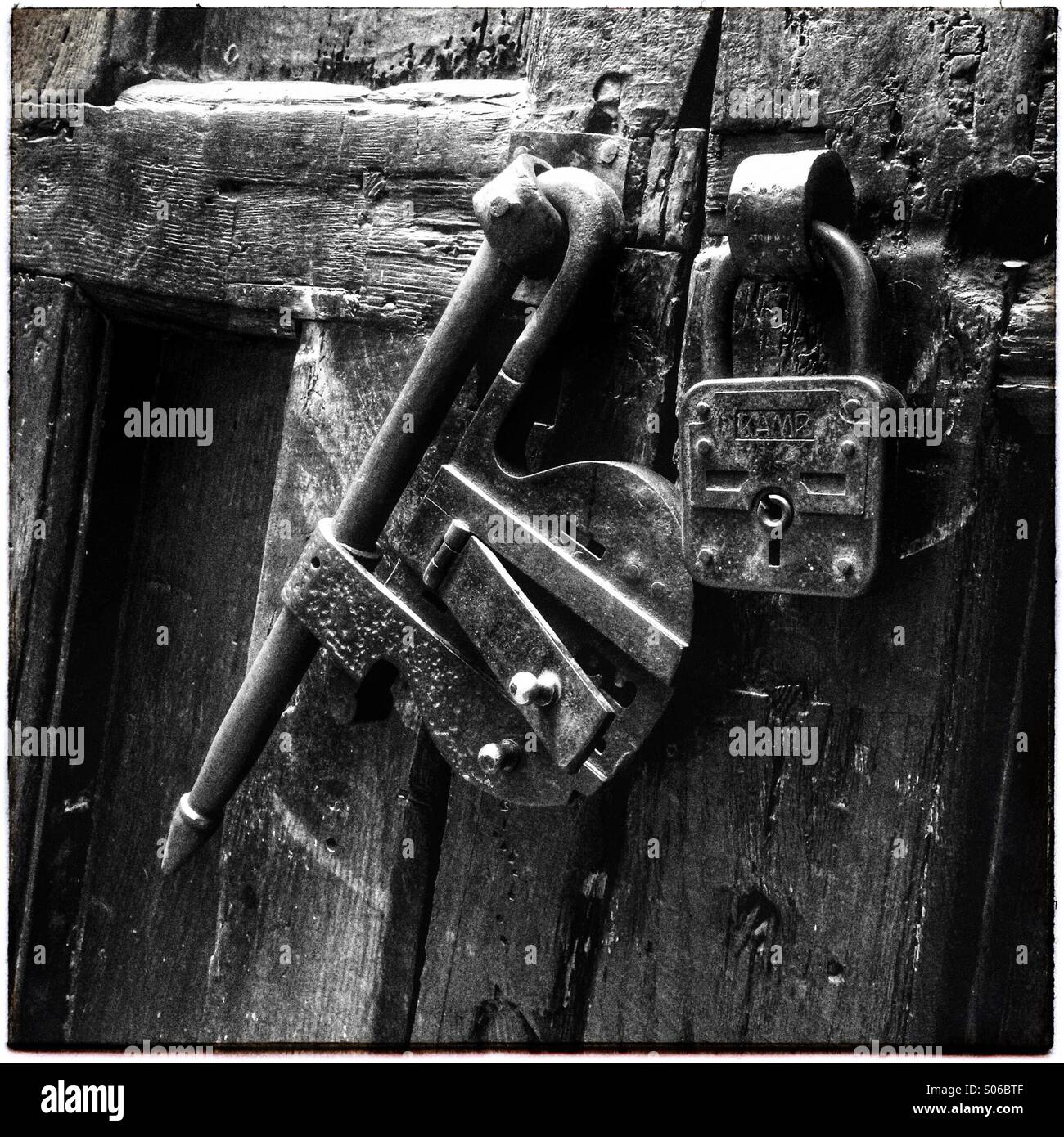 Old padlocks on a decaying Napoli doorway Stock Photo