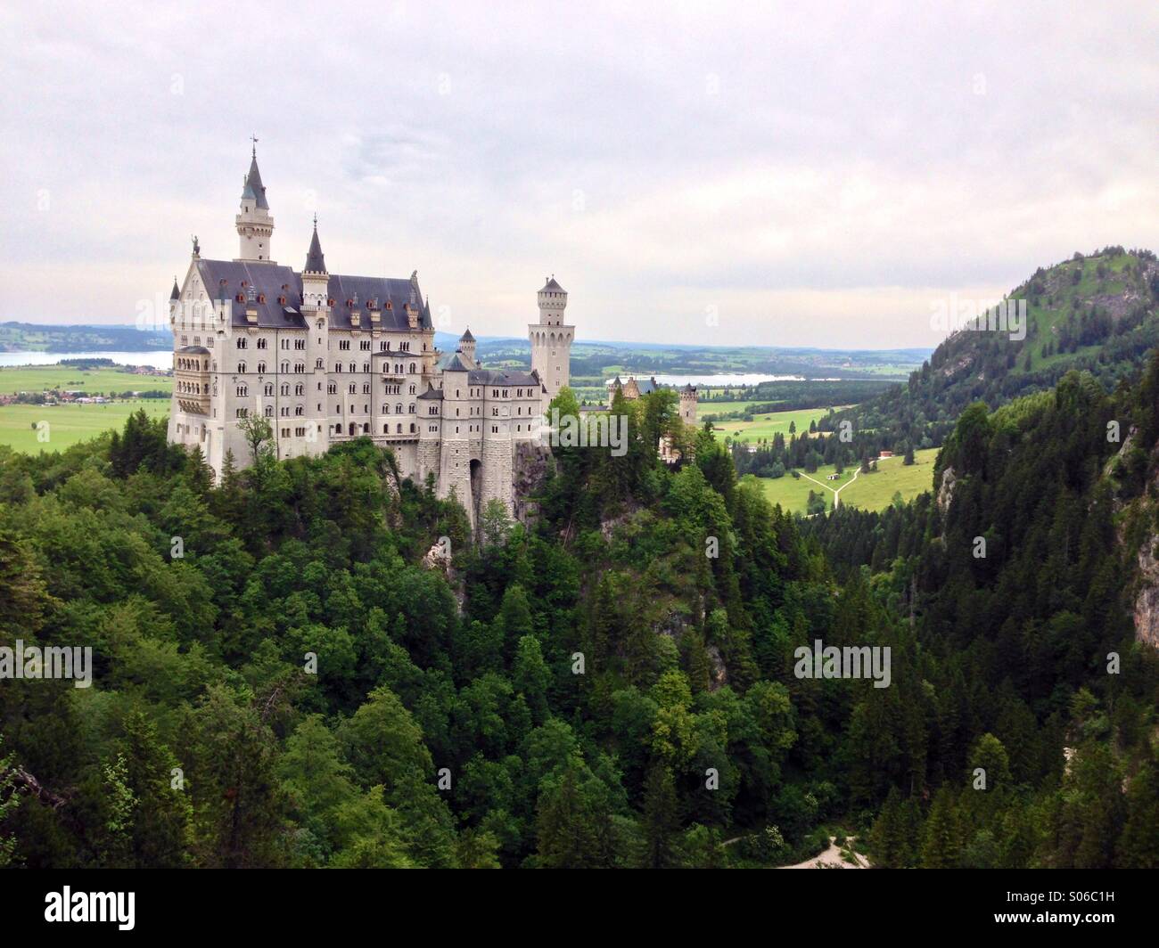 Neuschwanstein (New Swanstone) Castle was built by Ludwig II during the 19th century.  Walt Disney used the Castle as inspiration for Sleeping Beauty Castles at Disney Parks around the world. Stock Photo