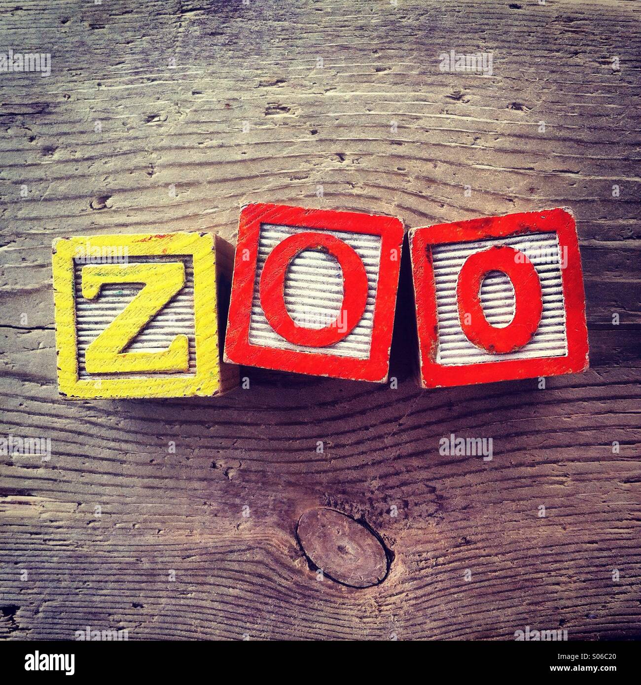 It's a photo of Woodblocks toy games with alphabet letters on them wich combine together to form the word ZOO - Smartphone Captured Stock Image