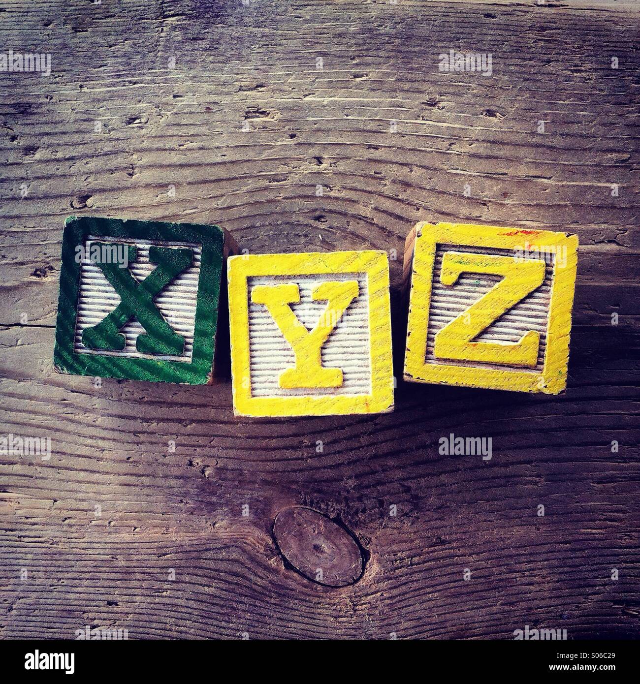 It's a photo of Woodblocks toy games with alphabet letters on them wich combine together to form XYZ - Smartphone Captured Stock Image