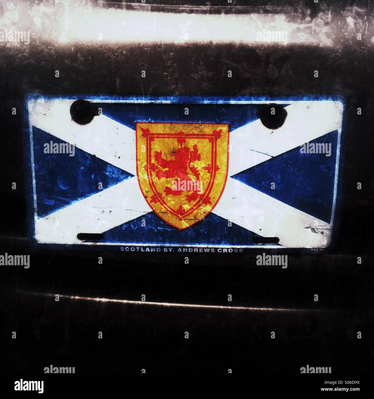 The flag of Nova Scotia is made up of the Scottish saltire (St. Andrews) flag with a Scottish lion rampant in the centre. This is on the front of a car. Stock Photo