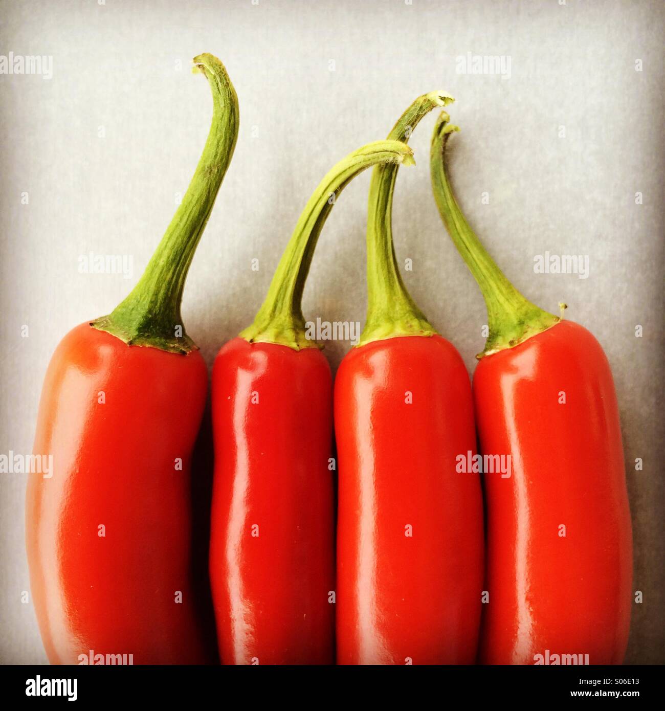 Four Serrano chile peppers, detail - Smartphone Captured Stock Image