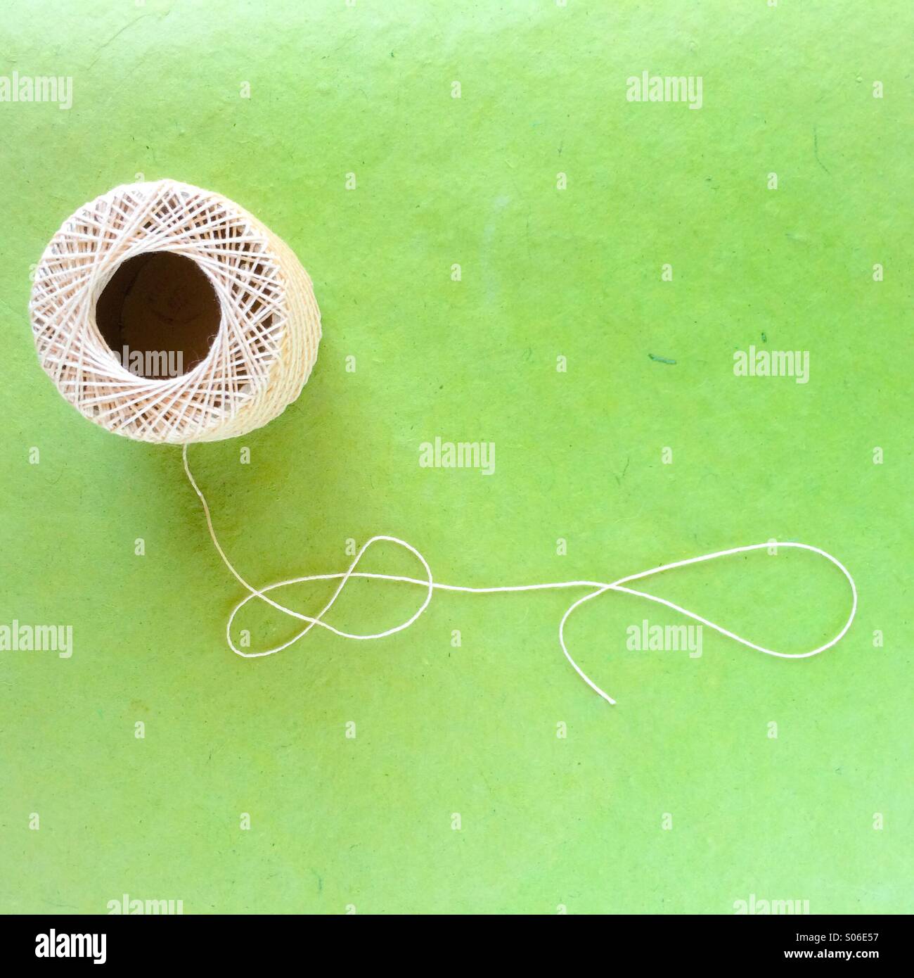 Ball of string on green - Smartphone Captured Stock Image