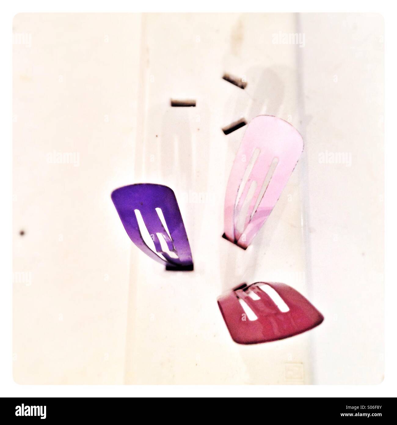 Hair clips in extension cord. - Smartphone Captured Stock Image