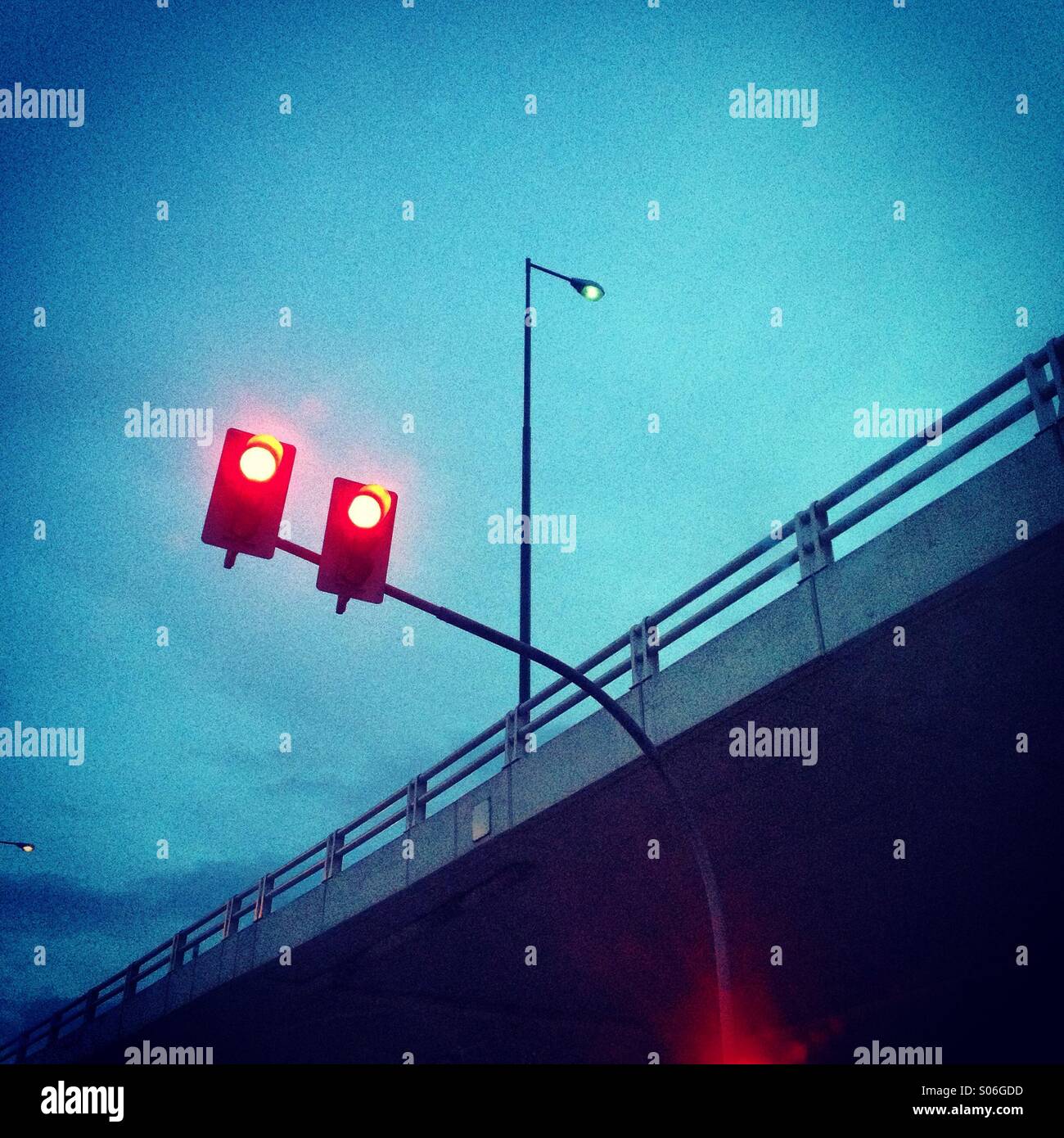 Red lights beneath overpass Stock Photo Alamy