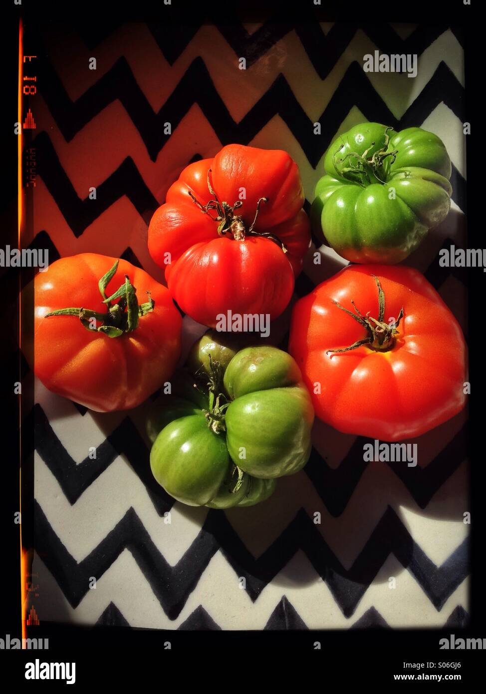 Marmande variety tomatoes in a zig zag designed bowl - Smartphone Captured Stock Image