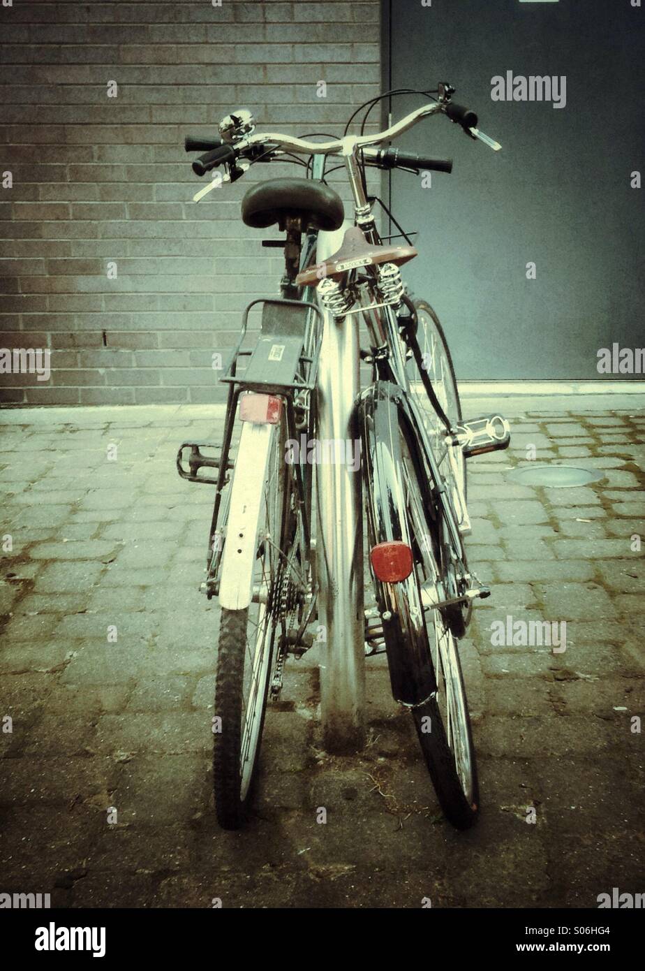 Two bicycles leaning together Stock Photo Alamy