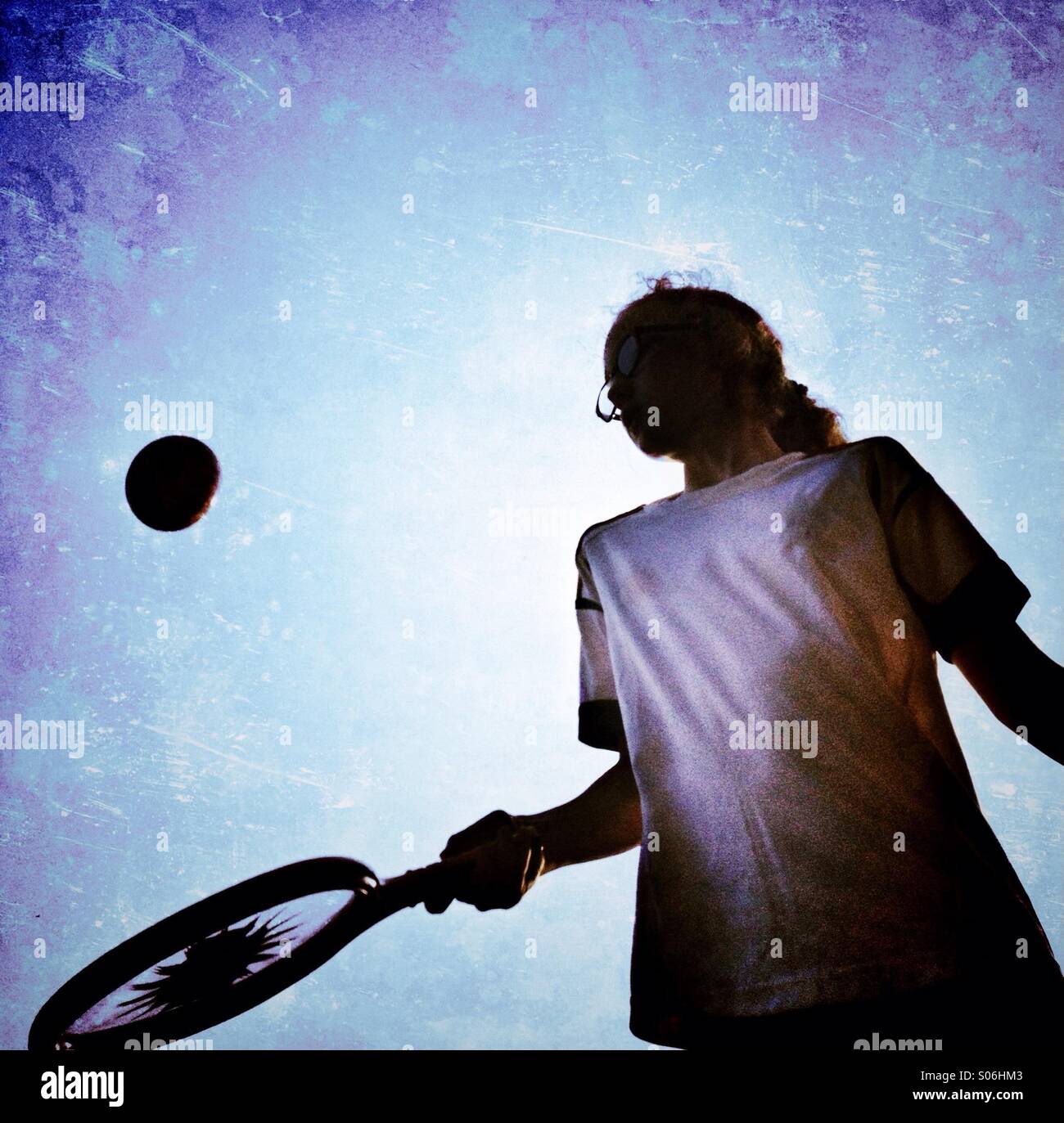 Girl bouncing ball on toy racket - Smartphone Captured Stock Image