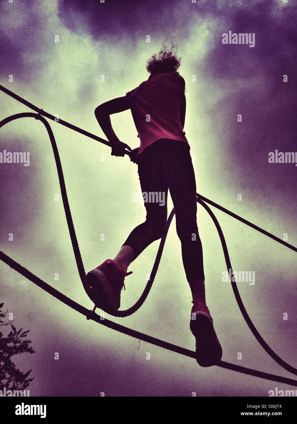 Girl Balancing On Rope Walk High Resolution Stock Photography and