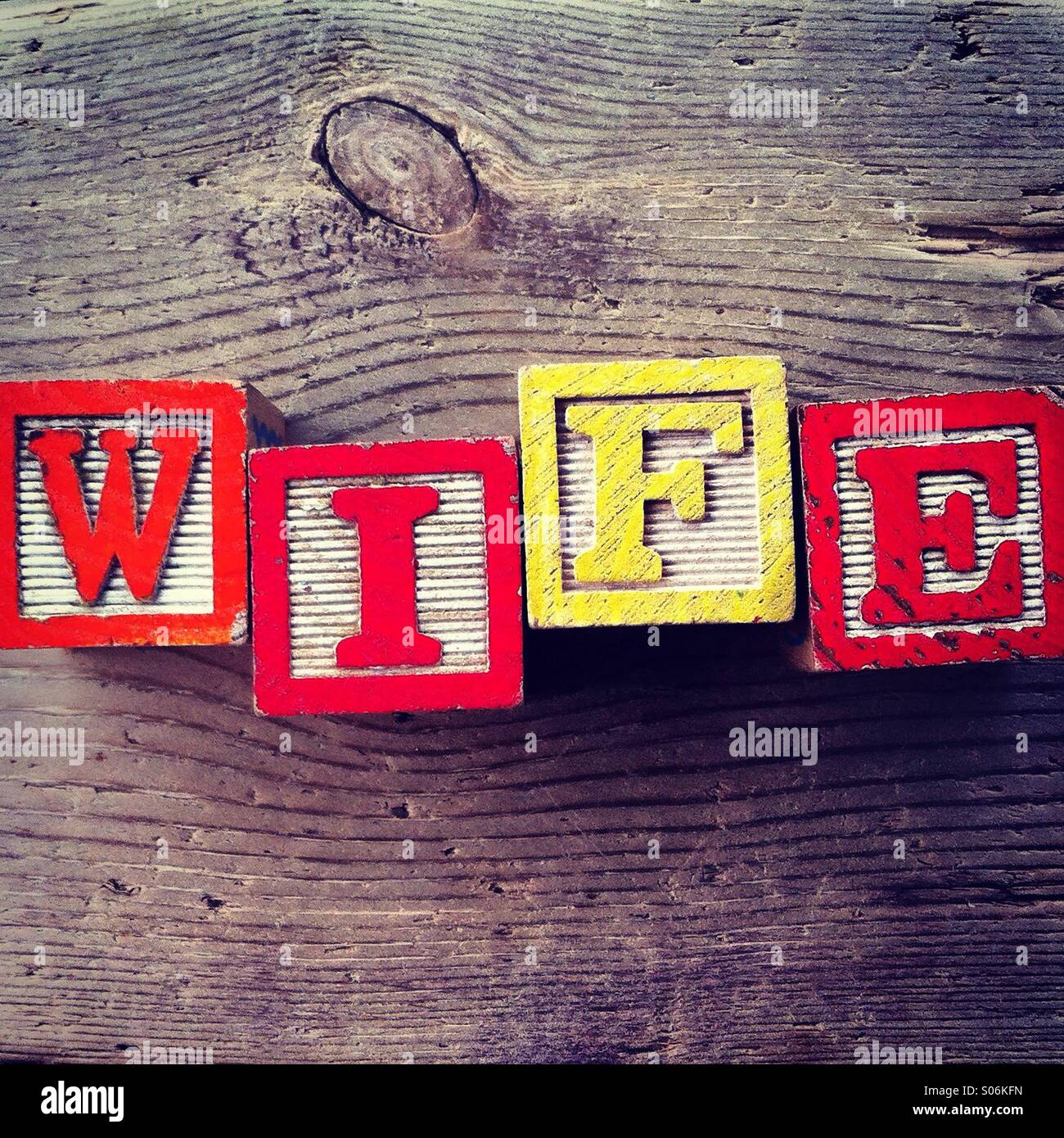 It's a photo of woodblocks toys will alphabet letter on them which are combines together to create the word WIFE - Smartphone Captured Stock Image