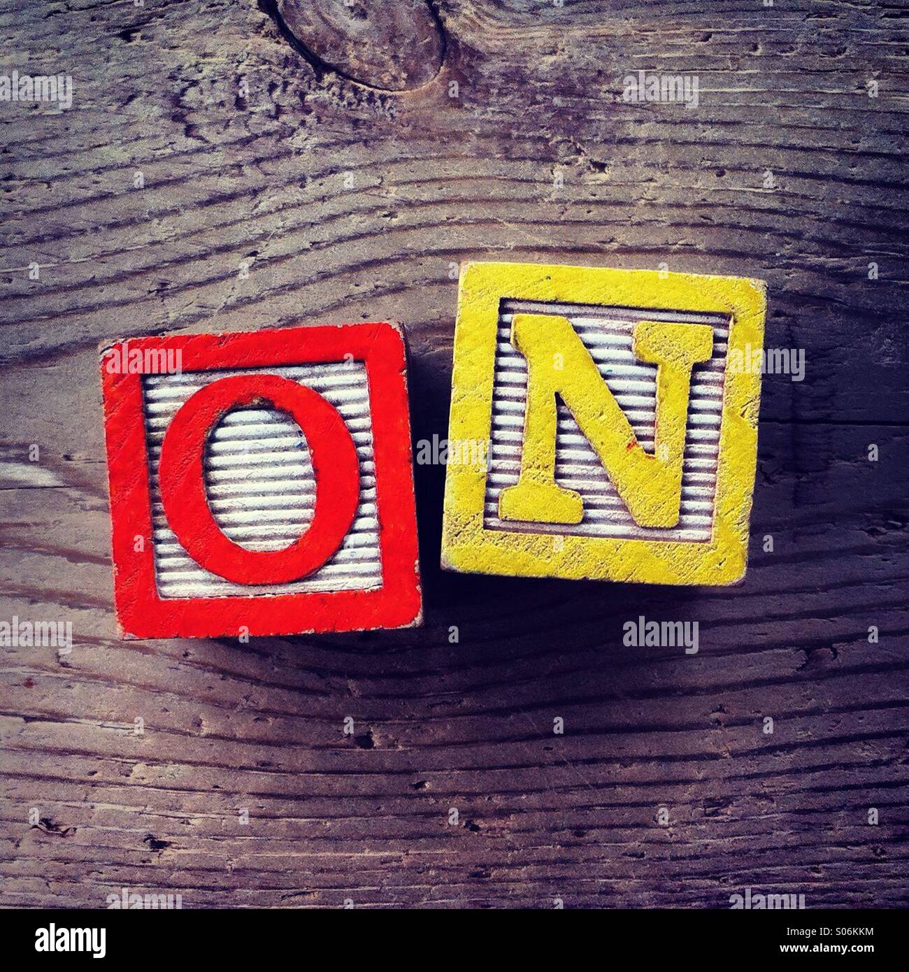 It's a photo of woodblocks toys will alphabet letter on them which are combines together to create the word ON - Smartphone Captured Stock Image