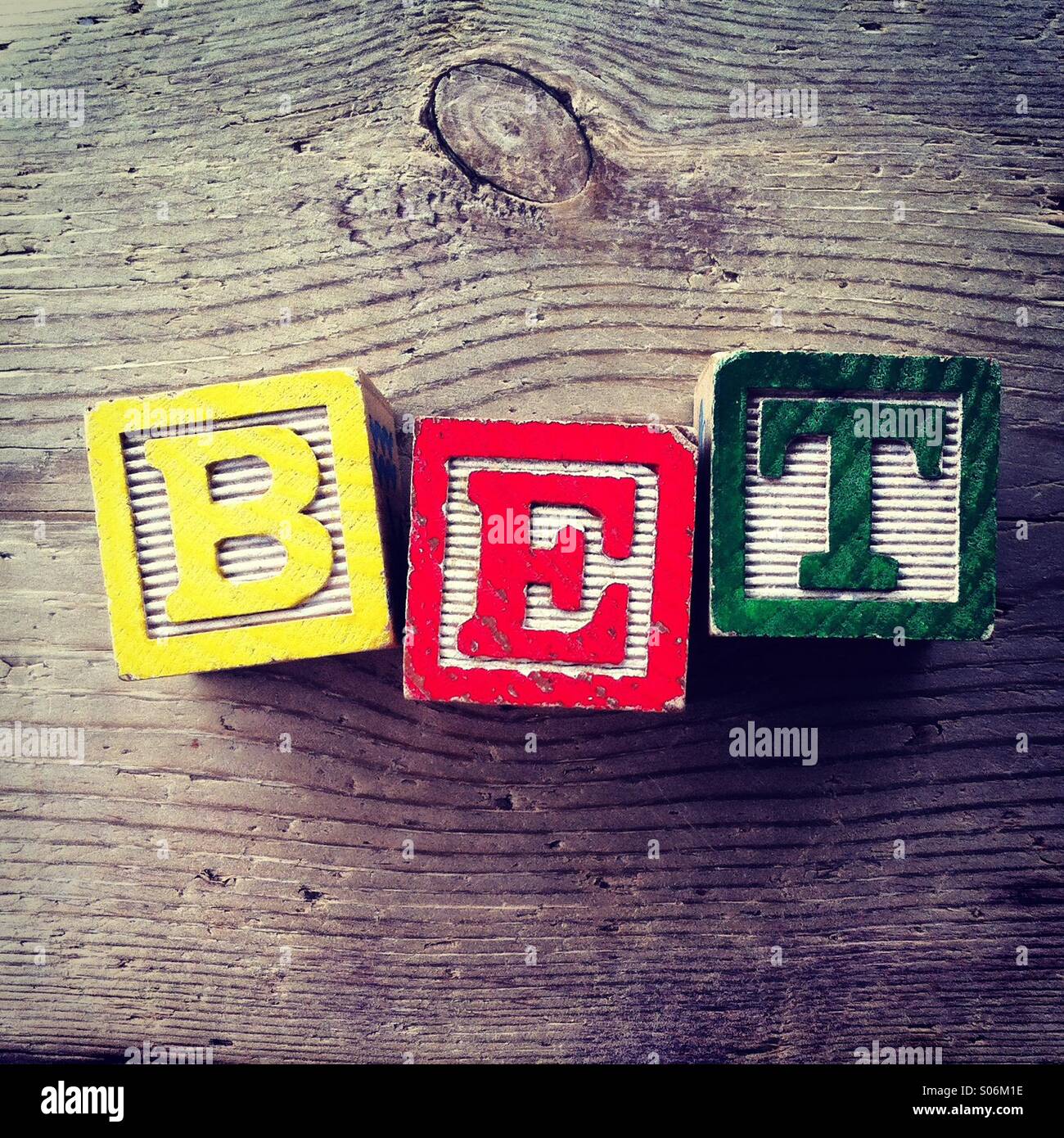 It's a photo of woodblocks toys will alphabet letter on them which are combines together to create the word BET Stock Photo