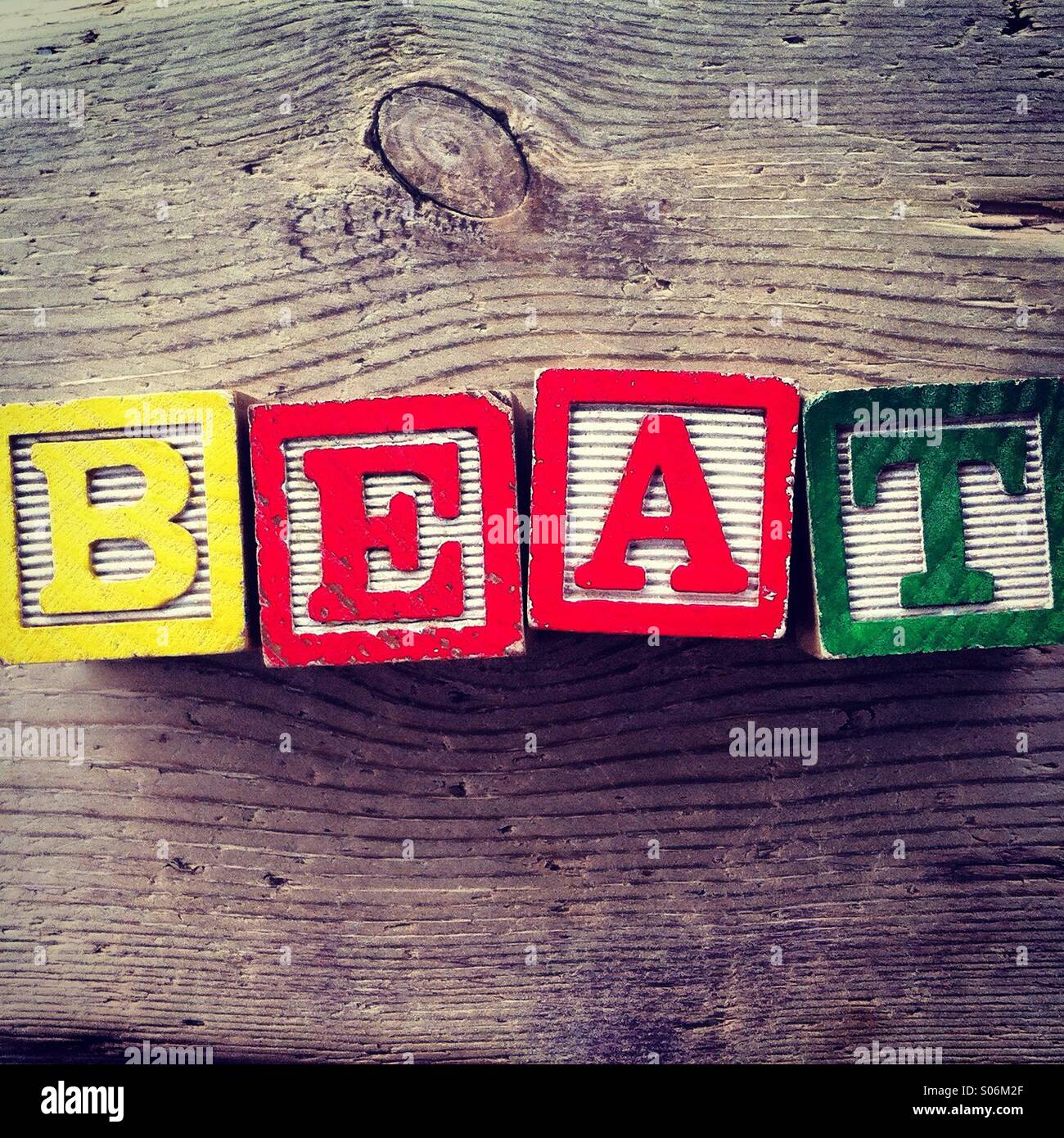 It's a photo of woodblocks toys will alphabet letter on them which are combines together to create the word BEAT - Smartphone Captured Stock Image