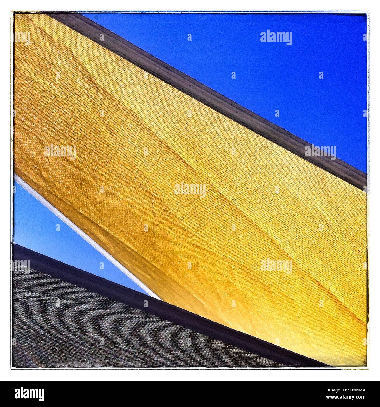 Garden shade sails against a blue sky - Smartphone Captured Stock Image