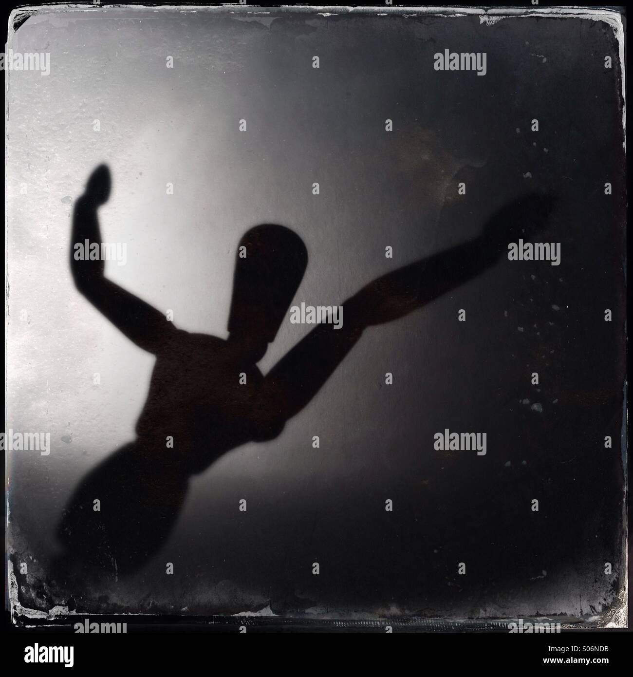 Sılhouette of a wooden doll - Smartphone Captured Stock Image