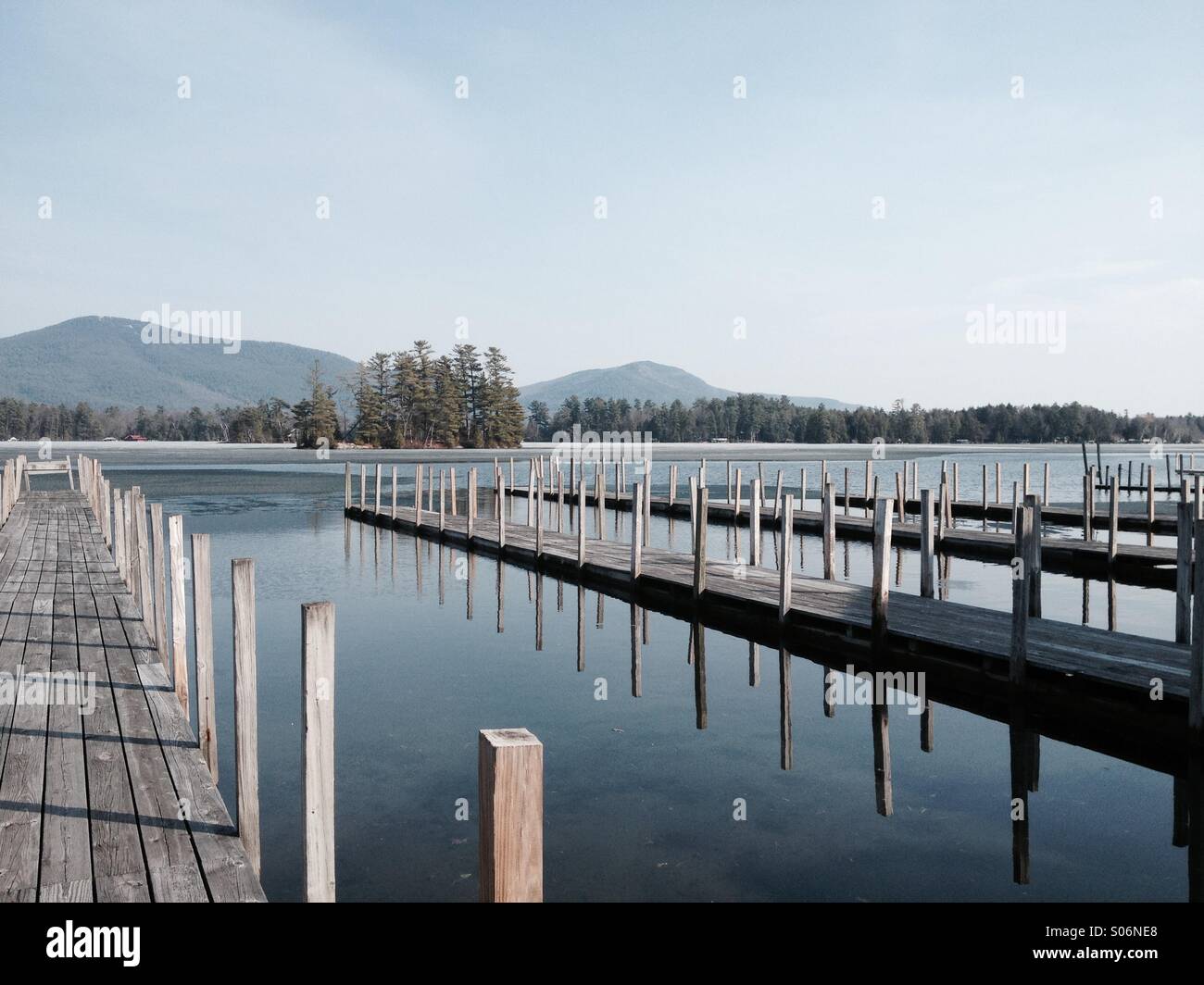 Ice melts on lake in the Adirondack Park in New York State Stock