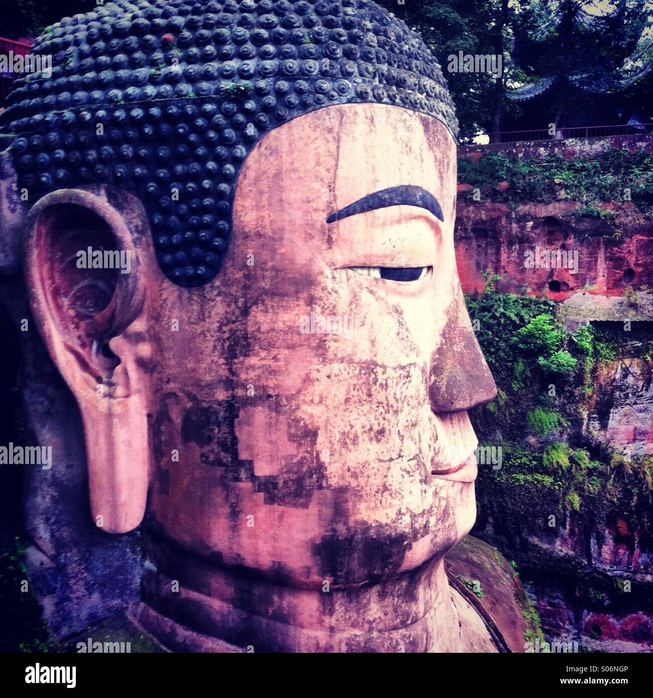 Giant buddha face profile view in Sichuan province in China - Smartphone Captured Stock Image