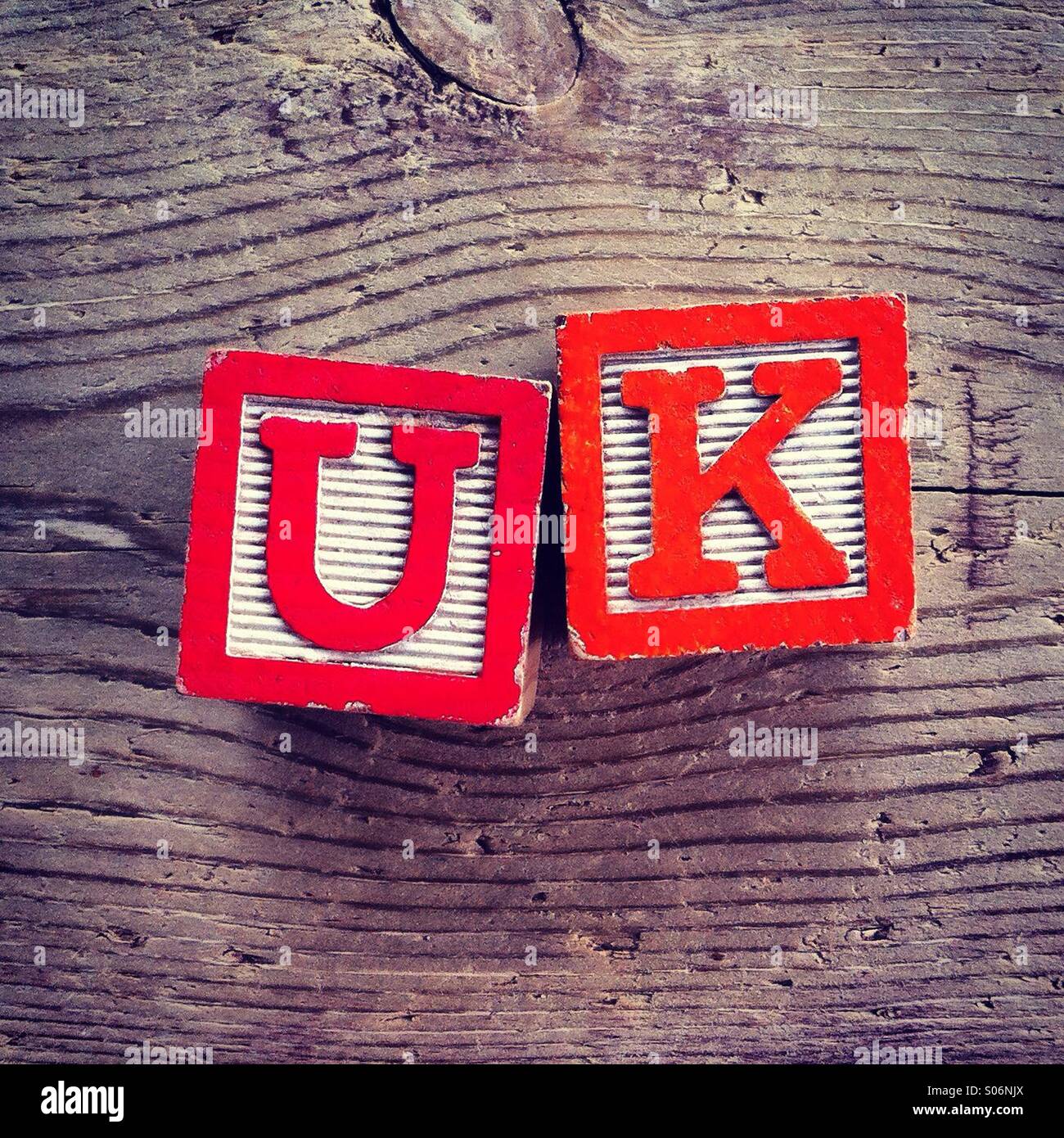 It's a photo of woodblocks toys will alphabet letter on them which are combines together to create the acronym: UK - Smartphone Captured Stock Image