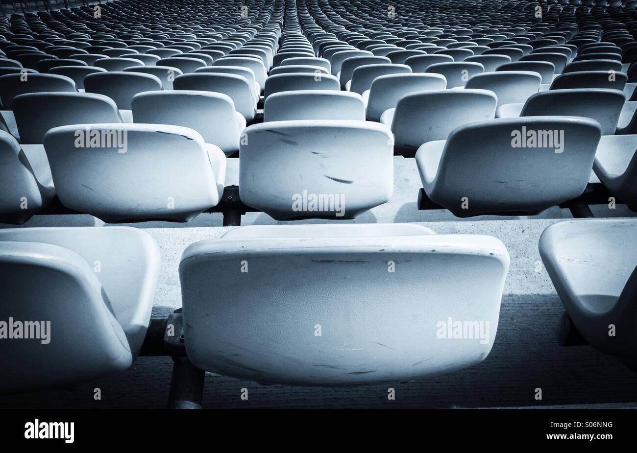 Row of empty blue seats at sport stadium Stock Photo