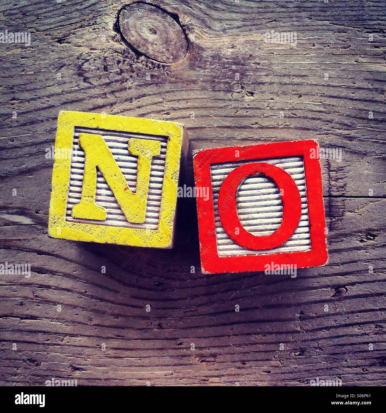 It's a photo of woodblocks toys will alphabet letter on them which are combines together to create the word NO - Smartphone Captured Stock Image
