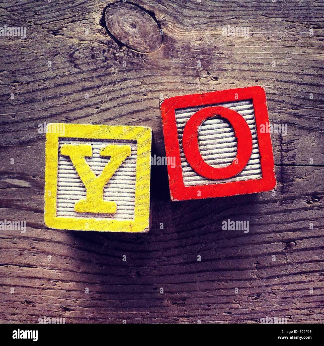 It's a photo of woodblocks toys will alphabet letter on them which are combines together to create the word YO - Smartphone Captured Stock Image