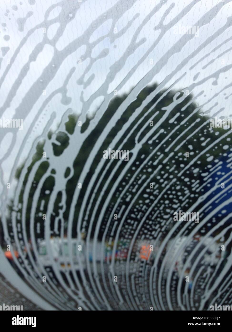 Car windscreen car wash bubbles soap suds Stock Photo Alamy