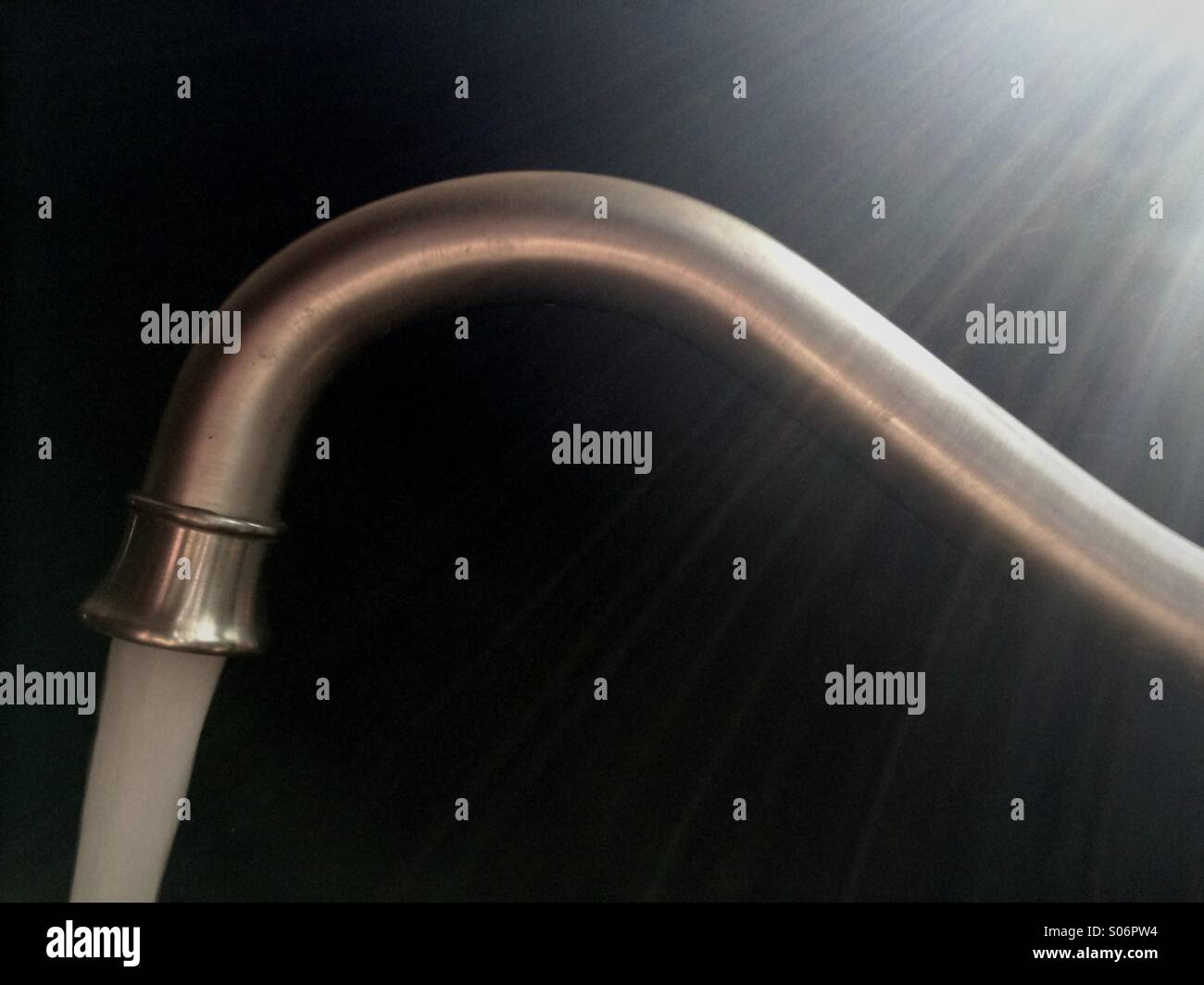 Faucet in kitchen pouring water - Smartphone Captured Stock Image