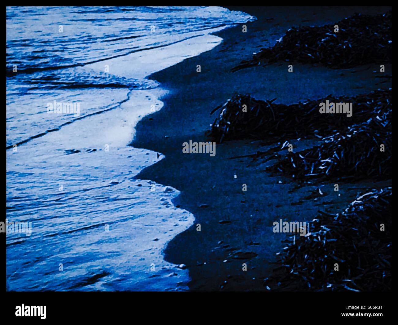 Moonlight blue sea and rocks Stock Photo