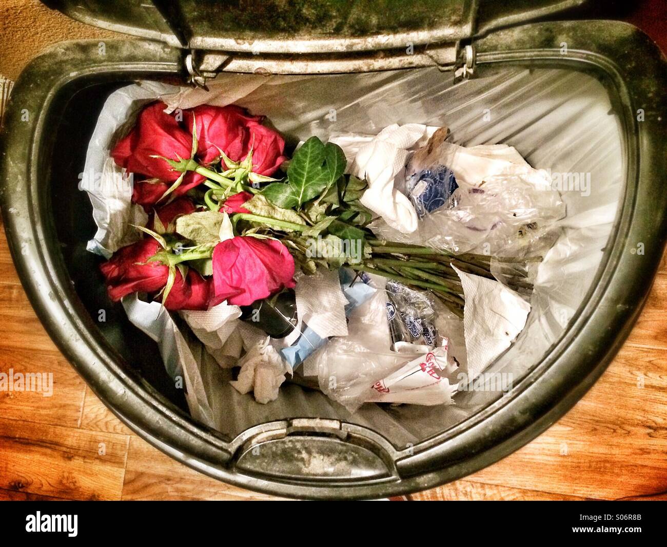 A bouquet of flowers in the trash Stock Photo Alamy