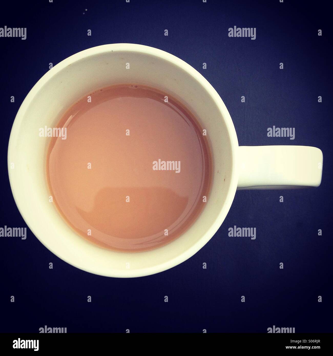 Part drunk cup of tea. Overhead view. Stock Photo