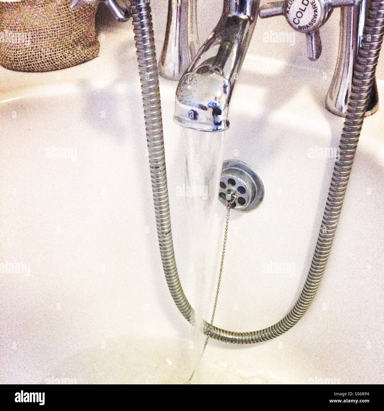 A flowing bath tap Stock Photo