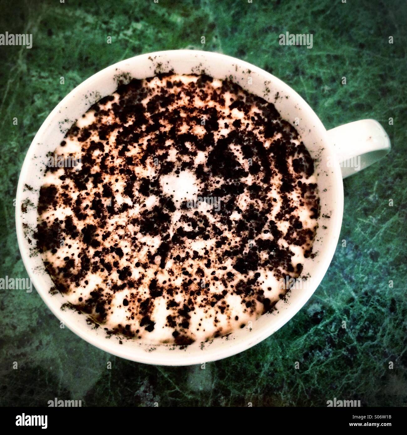 Latte coffee sprinkled with cocoa. - Smartphone Captured Stock Image