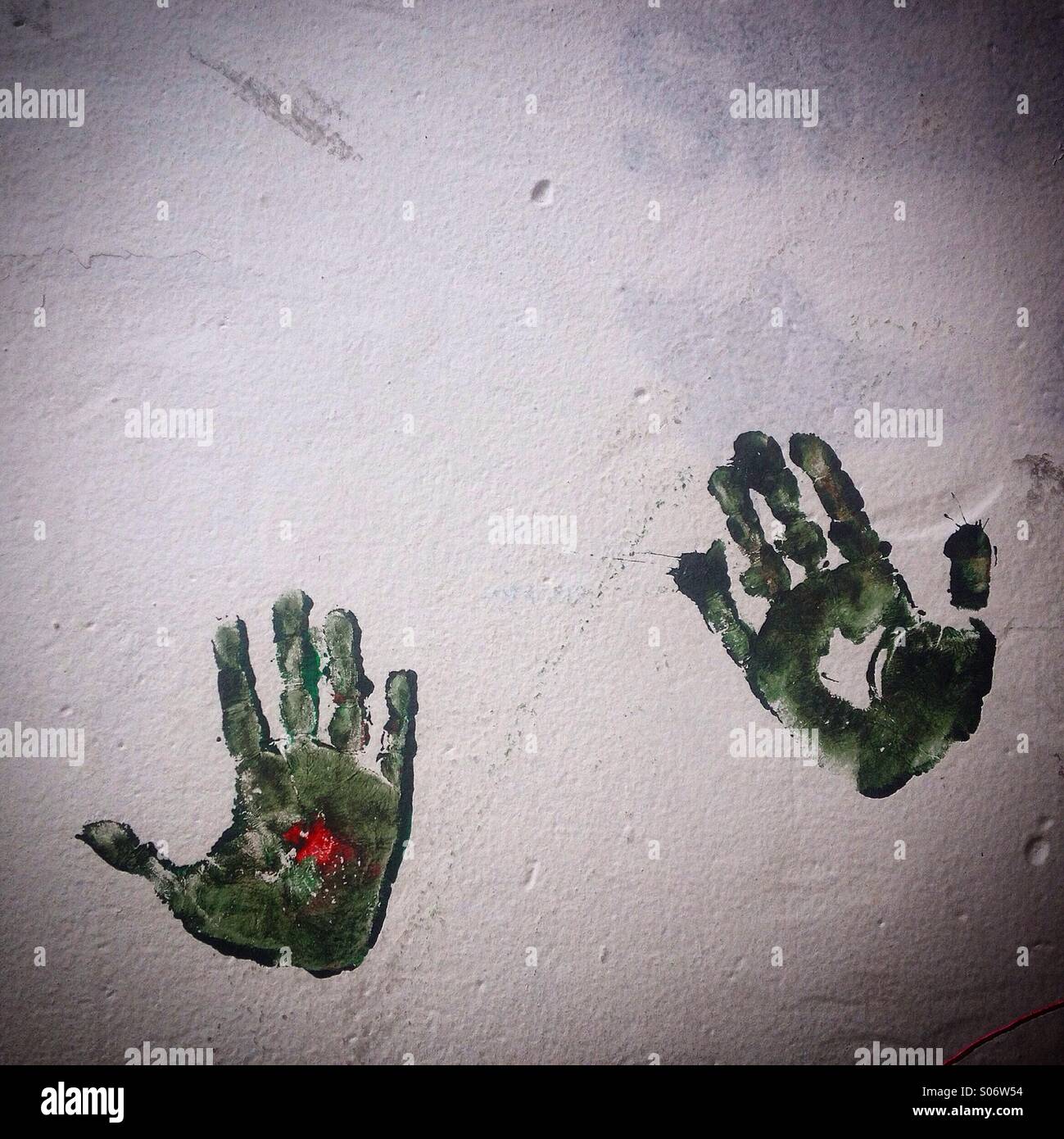 A pair of green hands prints decorate a wall in Mercado Medellin, Colonia Roma, Mexico City, Mexico Stock Photo