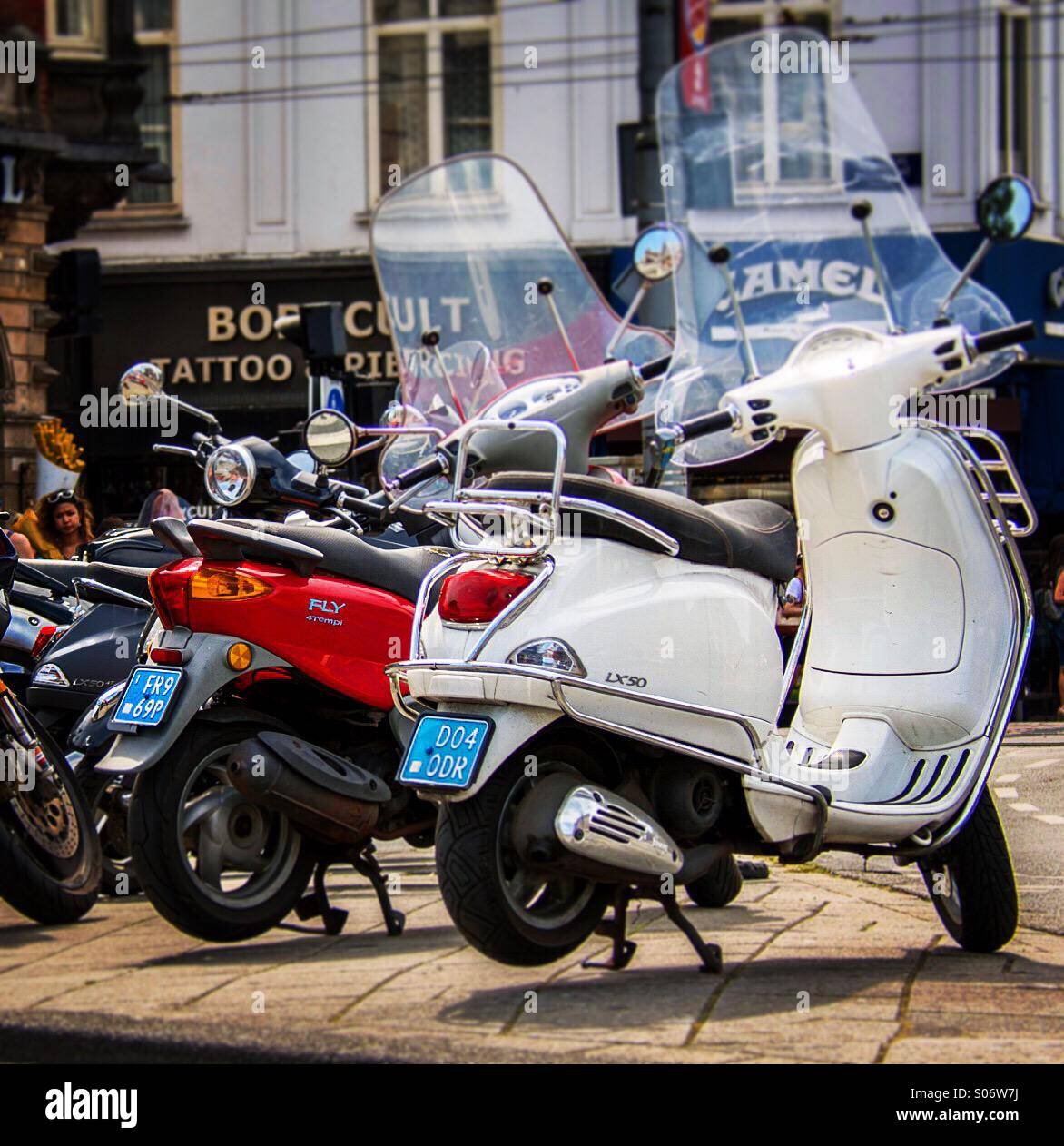 Mopeds parked on busy Amsterdam street - Smartphone Captured Stock Image