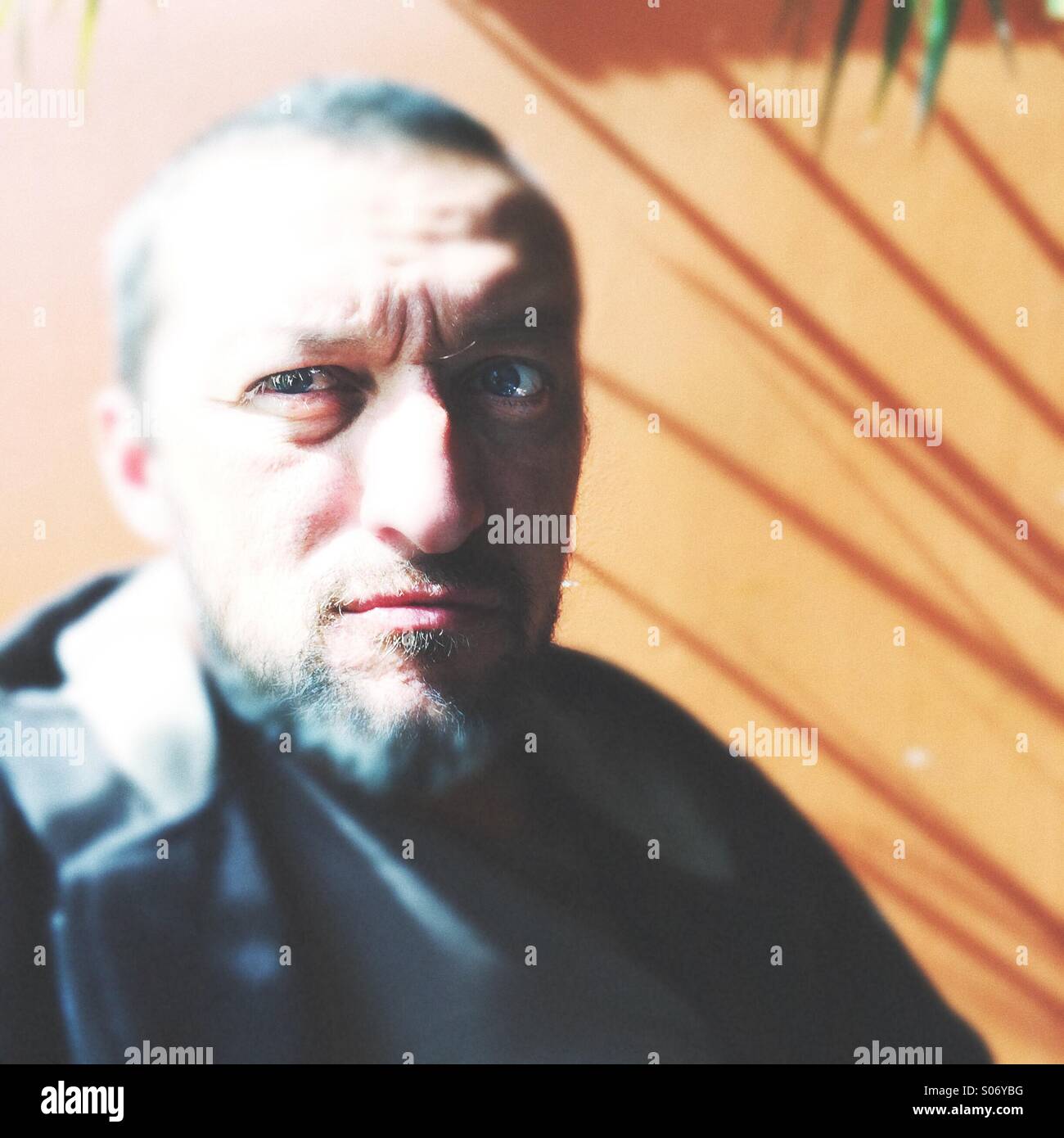 A man sits and looks - Smartphone Captured Stock Image