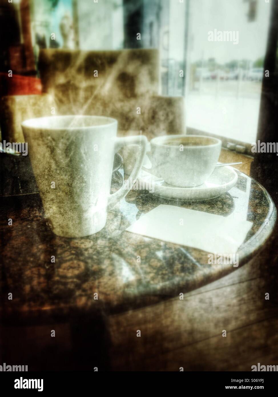 Tea cup and a mug of coffee on a table - Smartphone Captured Stock Image