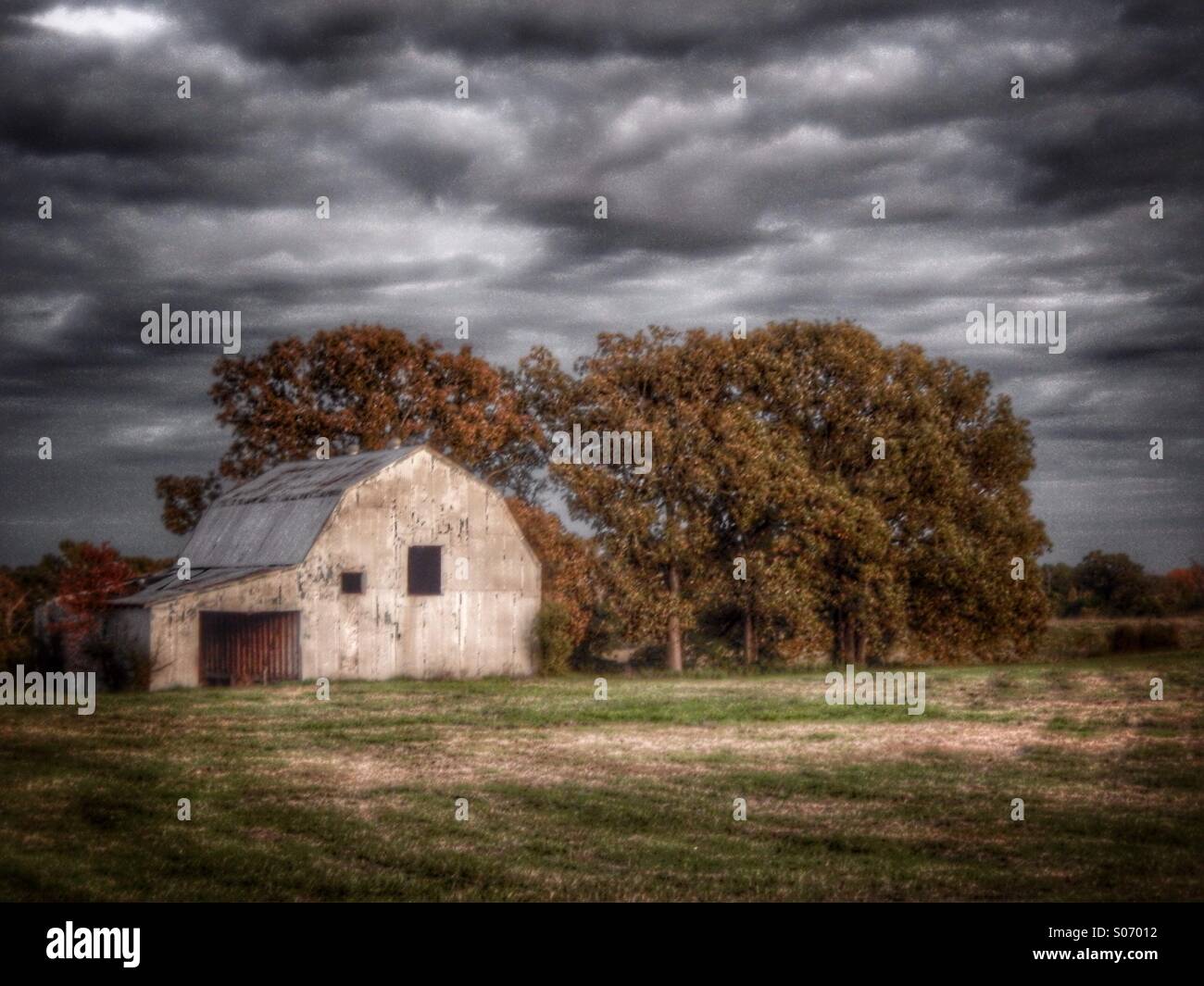 Old rustic barn sitting in a country field with a storm coming Stock ...