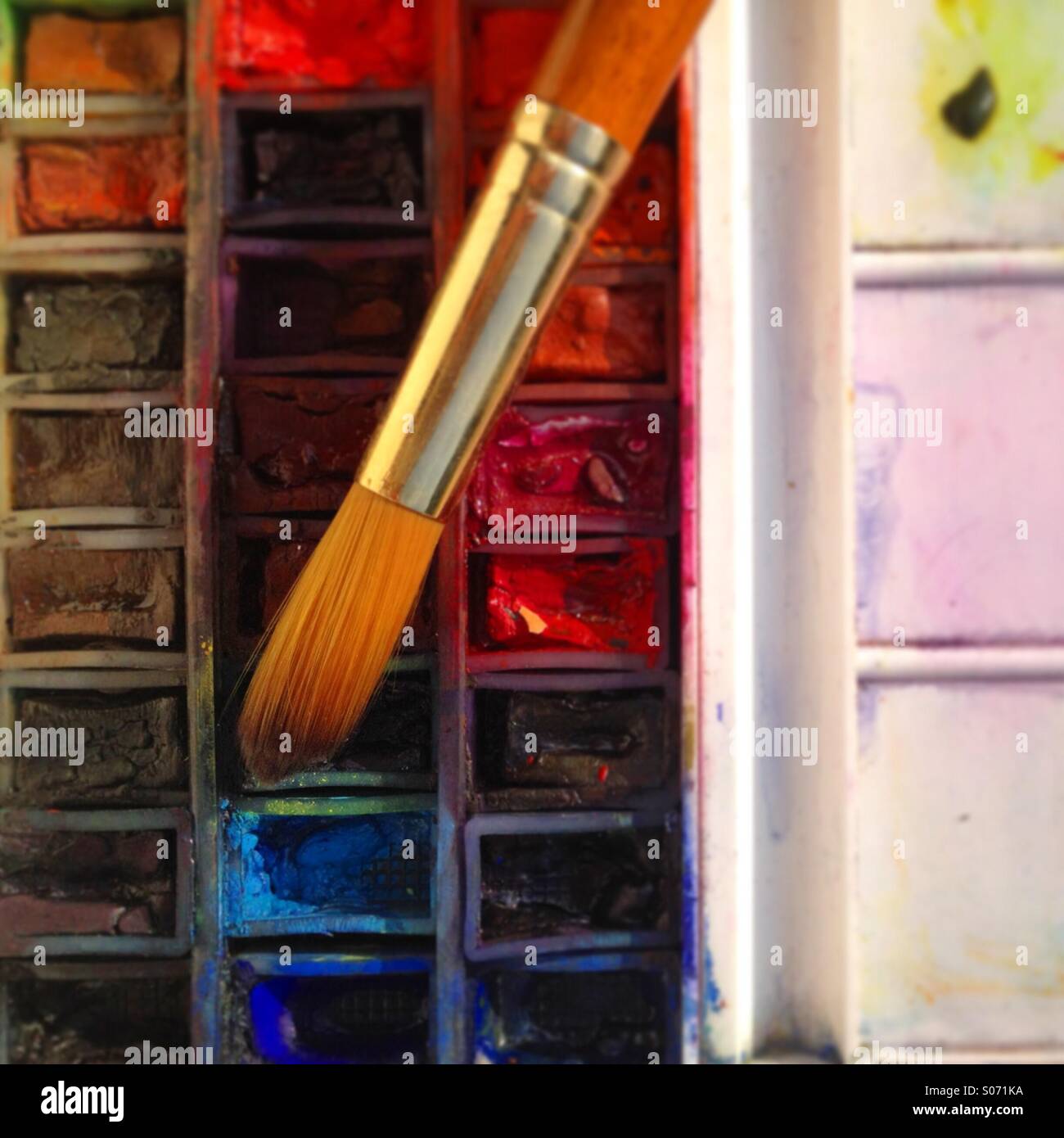 Well used artists watercolour palette and brush. Mobile phone photo with some phone or tablet post processing. - Smartphone Captured Stock Image