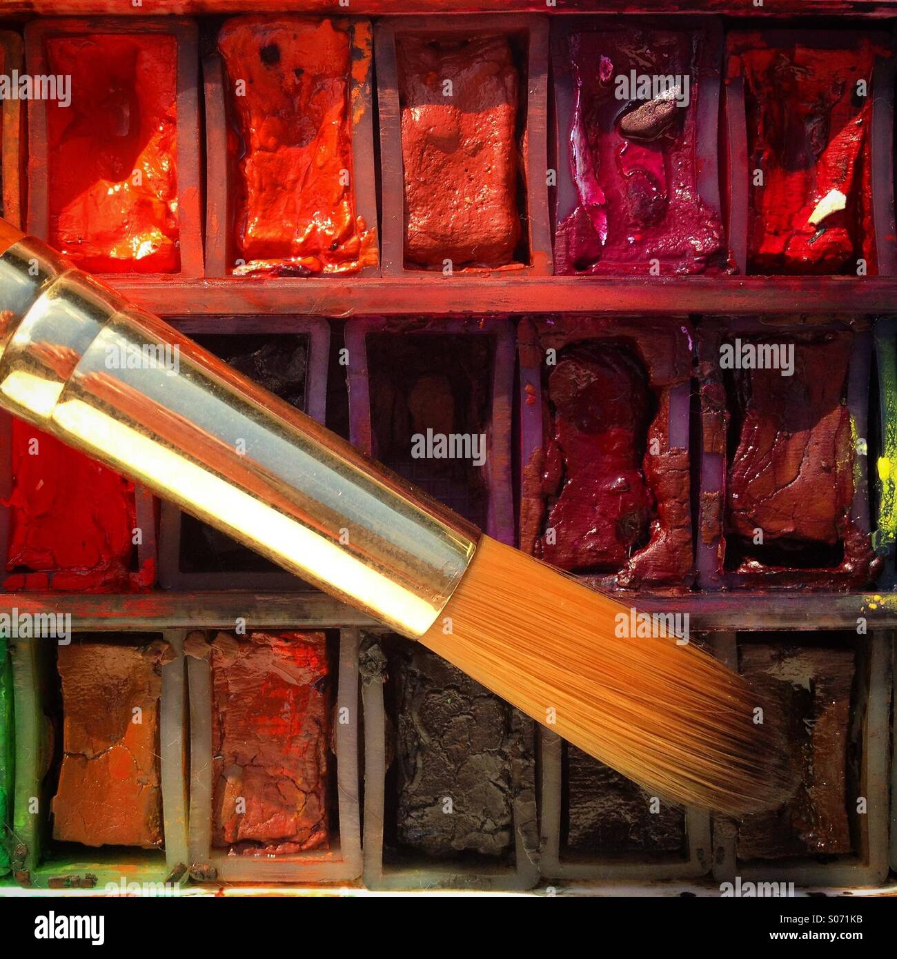 Watercolour paints and paintbrush close-up. Mobile phone photo with some phone or tablet post processing. - Smartphone Captured Stock Image